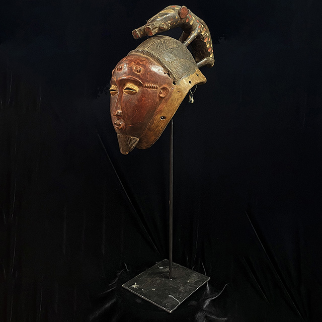 African Baule Mask 130 on stand Left Side- Click to zoom. African Baule Mask 130 on stand left side