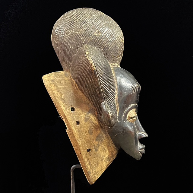 African Baule mask 131 on display stand side